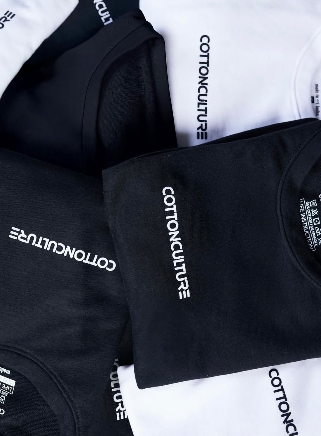 Folded tees with the chest wordmark